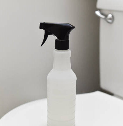 Cleaning spray on bathroom toilet